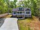 Beautiful gray home featuring a covered front porch with a well-maintained lawn and driveway at 292 Manchester Rd, Mount Gilead, NC 27306