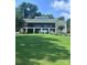 Beautiful exterior view of home with a green roof and large back porch at 292 Manchester Rd, Mount Gilead, NC 27306