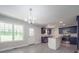 Modern kitchen featuring stainless steel appliances, stylish dark blue cabinets, and a central island at 292 Manchester Rd, Mount Gilead, NC 27306