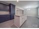 Modern kitchen features an island, stainless steel appliances, granite countertops, and ample cabinet space at 292 Manchester Rd, Mount Gilead, NC 27306