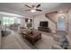 Open-concept living room featuring modern furniture, a ceiling fan, and connections to kitchen and dining at 292 Manchester Rd, Mount Gilead, NC 27306