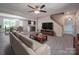 Open-concept living room flows into dining, kitchen, and stairway to additional bedrooms at 292 Manchester Rd, Mount Gilead, NC 27306