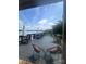 Inviting patio overlooking a serene lake, complete with outdoor seating and umbrellas for a relaxing atmosphere at 292 Manchester Rd, Mount Gilead, NC 27306