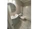 Bathroom features a round mirror and a tub with shower at 3200 Heathstead Pl # E, Charlotte, NC 28210