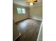 A bedroom featuring hardwood floors and a window at 3200 Heathstead Pl # E, Charlotte, NC 28210