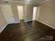 A bedroom featuring hardwood floors and walk-in closet at 3200 Heathstead Pl # E, Charlotte, NC 28210