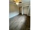 A bedroom featuring hardwood floors and closet at 3200 Heathstead Pl # E, Charlotte, NC 28210