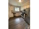 Modern kitchen featuring stainless steel appliances and granite countertops at 3200 Heathstead Pl # E, Charlotte, NC 28210