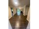 Open concept living room featuring sliding glass doors and neutral paint at 3200 Heathstead Pl # E, Charlotte, NC 28210