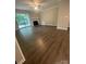 Well-lit living room featuring a fireplace and sliding glass doors at 3200 Heathstead Pl # E, Charlotte, NC 28210