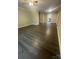 Spacious living room showcasing the open layout and hardwood floors at 3200 Heathstead Pl # E, Charlotte, NC 28210