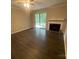 Bright living room featuring a fireplace and sliding glass doors at 3200 Heathstead Pl # E, Charlotte, NC 28210