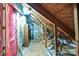 Unfinished attic space with exposed beams, pink insulation, and updated HVAC system at 333 W 7Th St, Charlotte, NC 28202