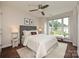 Bright bedroom with large window, ceiling fan, neutral walls, and plush accents at 333 W 7Th St, Charlotte, NC 28202