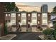 Charming townhomes featuring brick facades, attached garages, and well-maintained landscaping at 333 W 7Th St, Charlotte, NC 28202