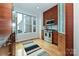 Stylish kitchen with stainless steel appliances and hardwood floors at 333 W 7Th St, Charlotte, NC 28202