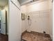 Utility room with washer/dryer hookups and additional storage shelving space at 333 W 7Th St, Charlotte, NC 28202