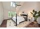 Spacious bedroom with high ceilings and large windows that offers plenty of natural light at 333 W 7Th St, Charlotte, NC 28202