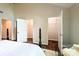 Bright bedroom with walk-in closets and a view of the en-suite bathroom at 333 W 7Th St, Charlotte, NC 28202