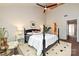 Bright bedroom with a bathroom en-suite and high vaulted ceilings with fan at 333 W 7Th St, Charlotte, NC 28202