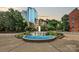 City skyline view from a park with water fountain feature at 333 W 7Th St, Charlotte, NC 28202