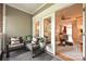 Inviting sunroom featuring comfortable seating and a view into the brightly lit living space at 333 W 7Th St, Charlotte, NC 28202