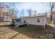 Inviting backyard featuring a screened-in porch, a well-maintained deck and private backyard for outdoor activities at 3433 Spinner Ct, Sherrills Ford, NC 28673