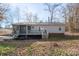 Backyard featuring a house with a deck and screened porch at 3433 Spinner Ct, Sherrills Ford, NC 28673