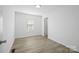 Bright, empty bedroom with white walls and light wood flooring, showcasing a simple design at 3433 Spinner Ct, Sherrills Ford, NC 28673