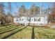 Beautiful home with a landscaped front yard, complemented by a welcoming porch, great for relaxing and enjoying the outdoors at 3433 Spinner Ct, Sherrills Ford, NC 28673