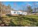 Charming home with a covered front porch, enhancing curb appeal and providing a welcoming entrance with well-kept front yard at 3433 Spinner Ct, Sherrills Ford, NC 28673