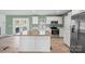 Modern kitchen featuring stainless steel appliances, white cabinets and an island with a wood countertop at 3433 Spinner Ct, Sherrills Ford, NC 28673