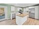 Updated kitchen featuring stainless steel appliances, white cabinetry, butcher block island and access to the deck at 3433 Spinner Ct, Sherrills Ford, NC 28673