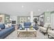 Open concept living area features a fireplace, stylish furnishings, light green walls and a seamless flow to the modern kitchen at 3433 Spinner Ct, Sherrills Ford, NC 28673