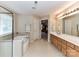 Large primary bathroom features a corner tub, walk-in shower, and double sink vanity at 3533 Weddington Ridge Ln, Matthews, NC 28105