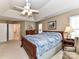 Comfortable primary bedroom with neutral carpet, tray ceiling, and an ensuite bathroom at 3533 Weddington Ridge Ln, Matthews, NC 28105