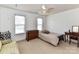 Cozy bedroom with neutral carpet, a ceiling fan, and two windows for lots of natural light at 3533 Weddington Ridge Ln, Matthews, NC 28105