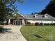 Charming clubhouse featuring a brick facade, manicured lawn, and a welcoming entrance, perfect for community gatherings at 3533 Weddington Ridge Ln, Matthews, NC 28105