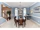 Charming dining room with a traditional table, chair rail detail, and views to the foyer at 3533 Weddington Ridge Ln, Matthews, NC 28105