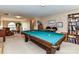 Open concept game room with billiard table, sitting area, and staircase to the entry at 3533 Weddington Ridge Ln, Matthews, NC 28105