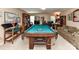 Spacious game room with a billiard table, comfortable seating, and built-in bookcases at 3533 Weddington Ridge Ln, Matthews, NC 28105