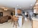 Bright kitchen with a breakfast bar, views to living and dining, and modern appliances at 3533 Weddington Ridge Ln, Matthews, NC 28105