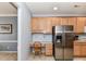The kitchen features lots of light wood cabinets, stainless steel fridge, and a built-in desk at 3533 Weddington Ridge Ln, Matthews, NC 28105
