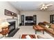 Inviting living room with a cozy fireplace, plush seating, and a large television for relaxing evenings at 3533 Weddington Ridge Ln, Matthews, NC 28105