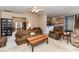 Spacious living room featuring comfortable seating, a view of the foyer, and access to the kitchen at 3533 Weddington Ridge Ln, Matthews, NC 28105