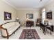 Cozy living room featuring neutral walls, a plush rug, and a mix of classic furniture at 3533 Weddington Ridge Ln, Matthews, NC 28105
