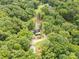 Stunning aerial view showcasing a secluded home surrounded by dense forest and pond, offering privacy and natural beauty at 3547 Willowood Pond Dr, Rock Hill, SC 29730