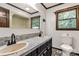 Bathroom with dual sinks, decorative tile flooring, toilet, and shower at 3547 Willowood Pond Dr, Rock Hill, SC 29730