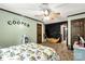 Bedroom features a canoe, ceiling fan, door and a desk at 3547 Willowood Pond Dr, Rock Hill, SC 29730