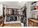 Organized walk-in closet with ample hanging space, shelving, and storage drawers in a home at 3547 Willowood Pond Dr, Rock Hill, SC 29730